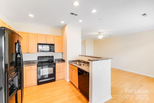 a view of kitchen with furniture and large window