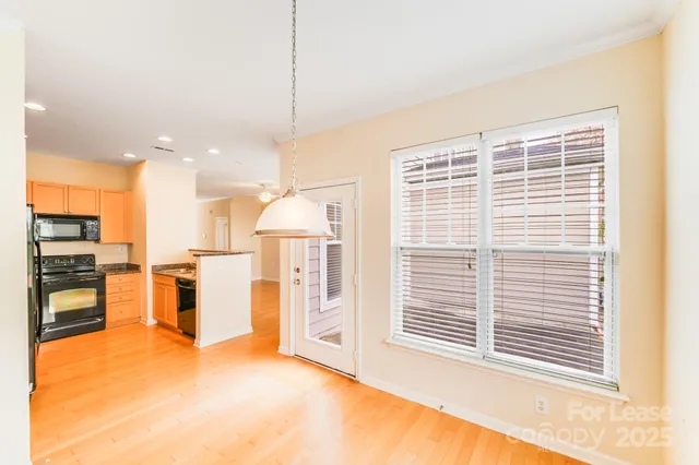 a view of an empty room with a ceiling fan