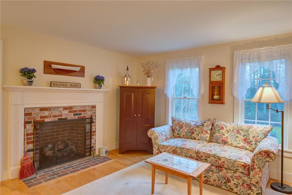 64 Walpole Meeting House Road Walpole, ME 04573 - Photo 11 of 35 Fireplace with gas insert for ambience.