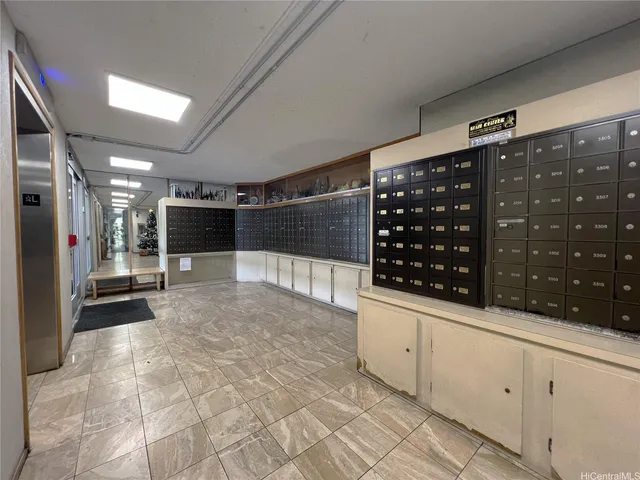 a kitchen with a sink and stainless steel appliances
