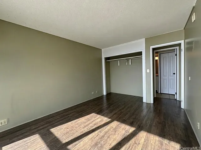 a view of balcony with wooden floor and fence