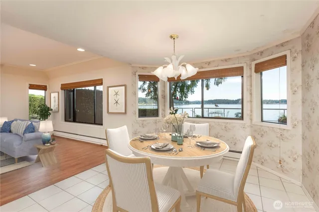 a view of a dining room with furniture wooden floor and chandelier