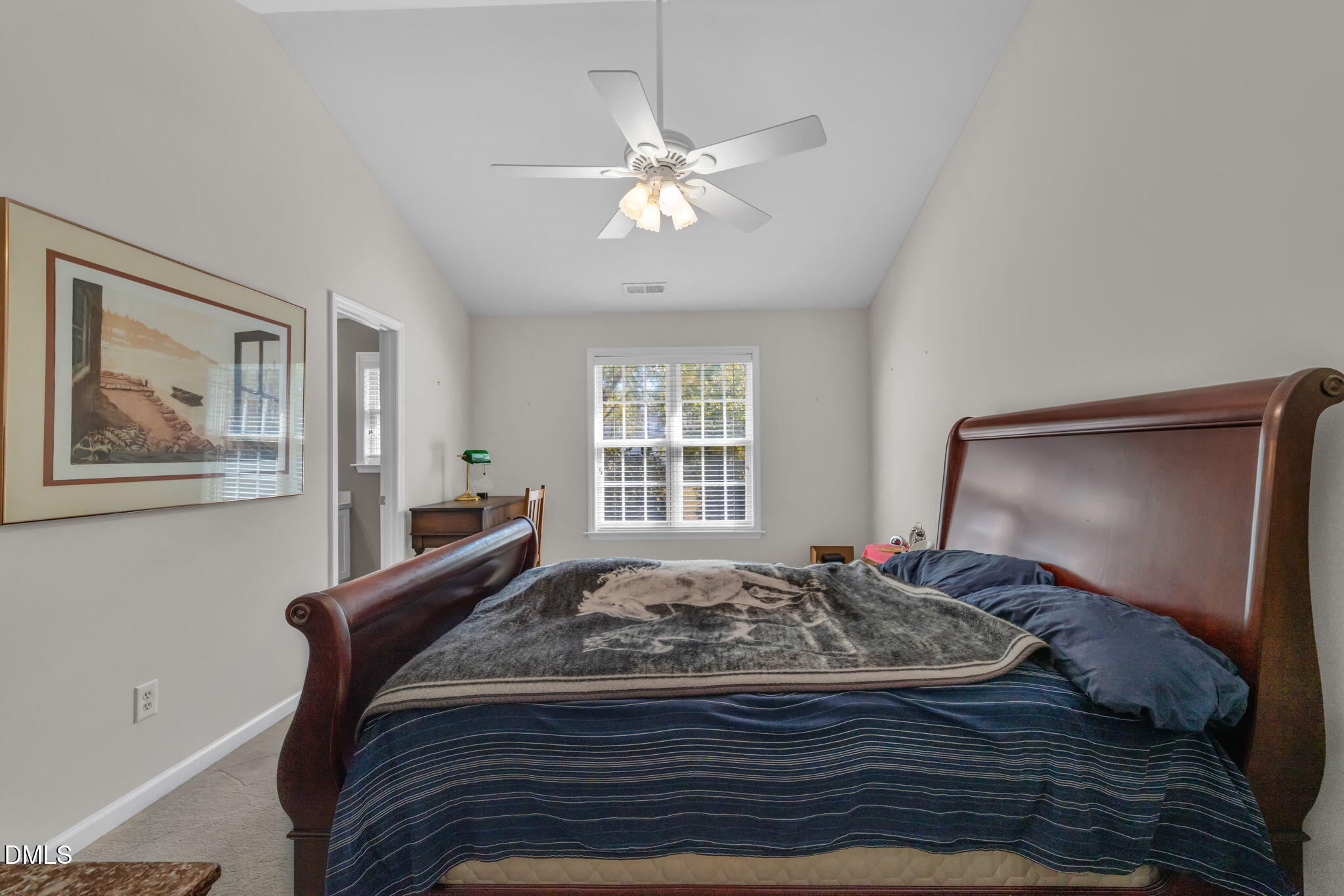 2140 Thornblade Drive Raleigh, NC 27604 - Photo 20 of 48 a bed sitting in a bedroom next to a window