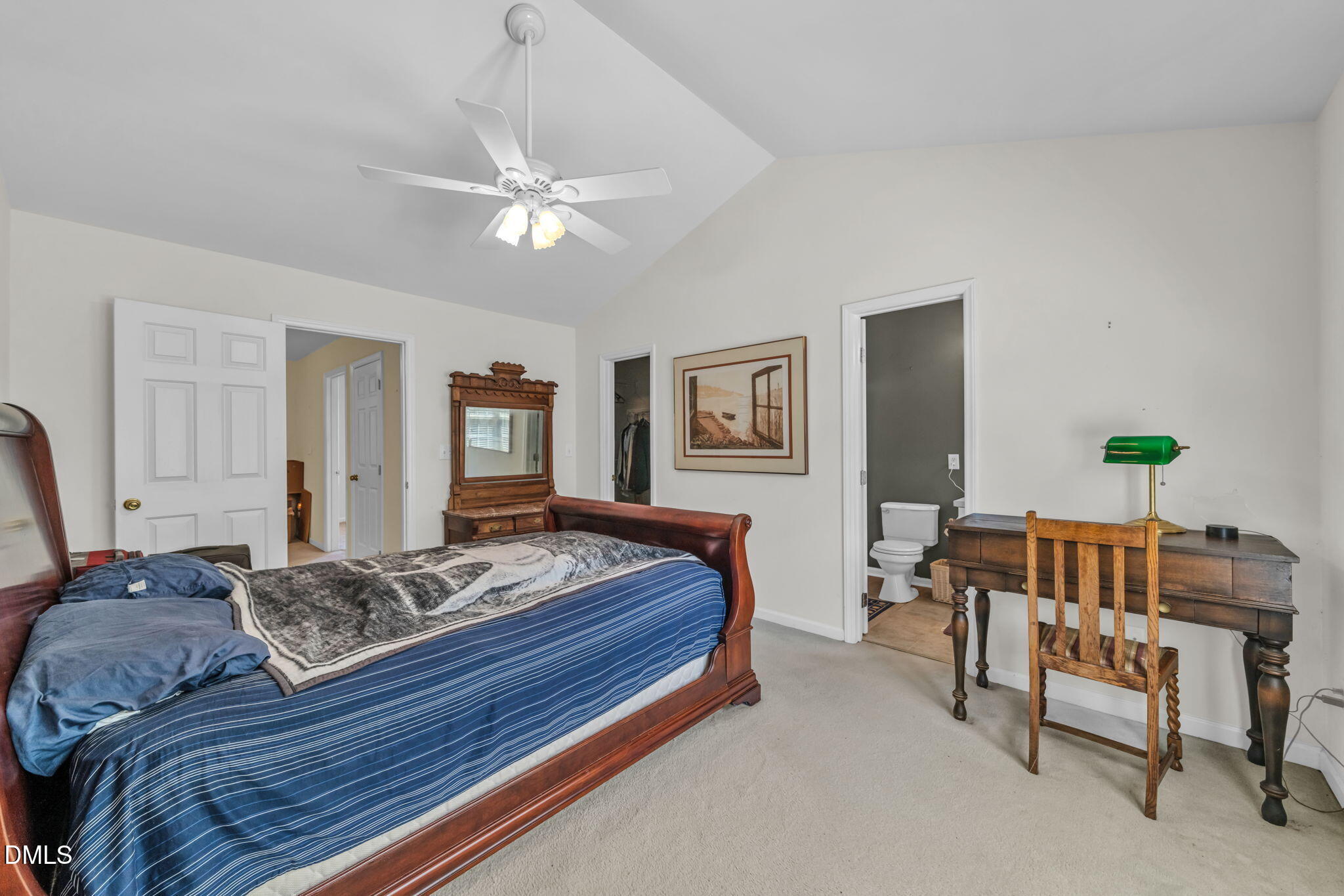 2140 Thornblade Drive Raleigh, NC 27604 - Photo 22 of 48 a bedroom with a bed and a chandelier