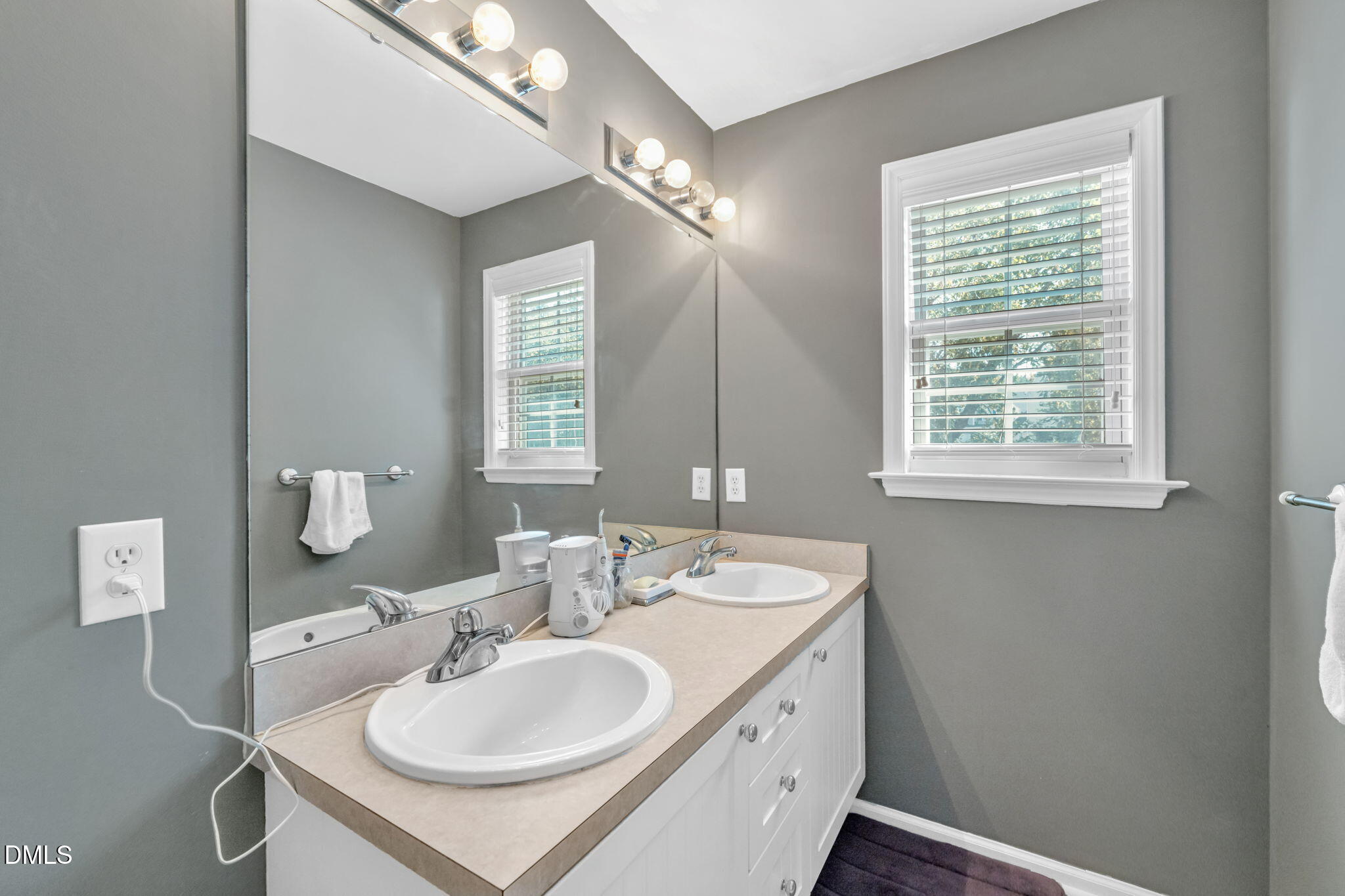 2140 Thornblade Drive Raleigh, NC 27604 - Photo 23 of 48 a bathroom with a sink double vanity and a mirror