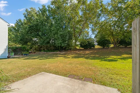 a view of a swimming pool with an outdoor space and seating area