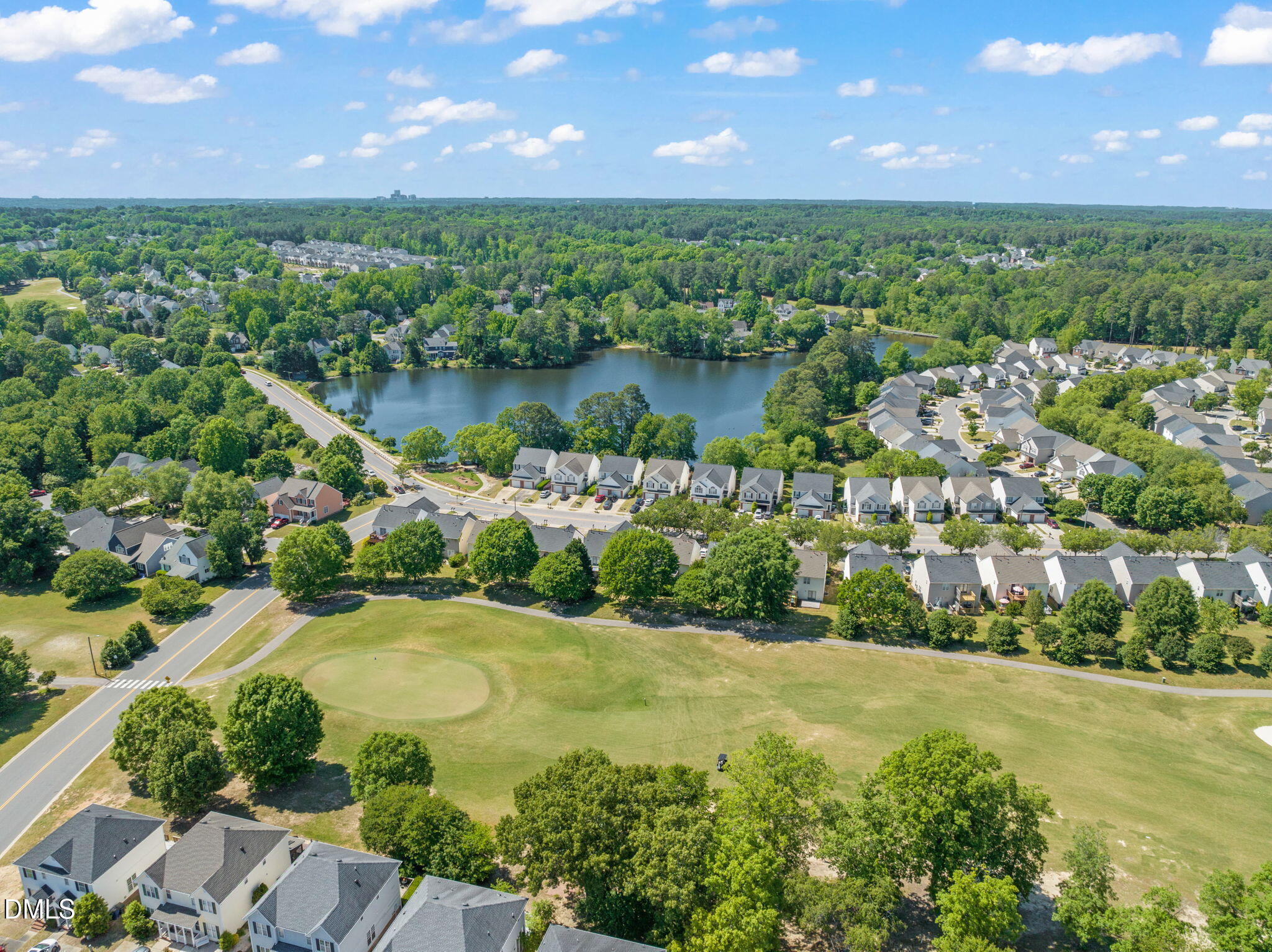 2140 Thornblade Drive Raleigh, NC 27604 - Photo 40 of 48 a view of a lake with a city