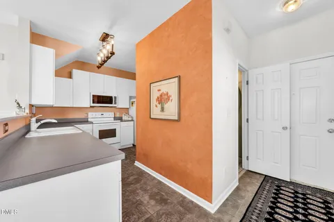 a view of a kitchen with appliances and cabinets