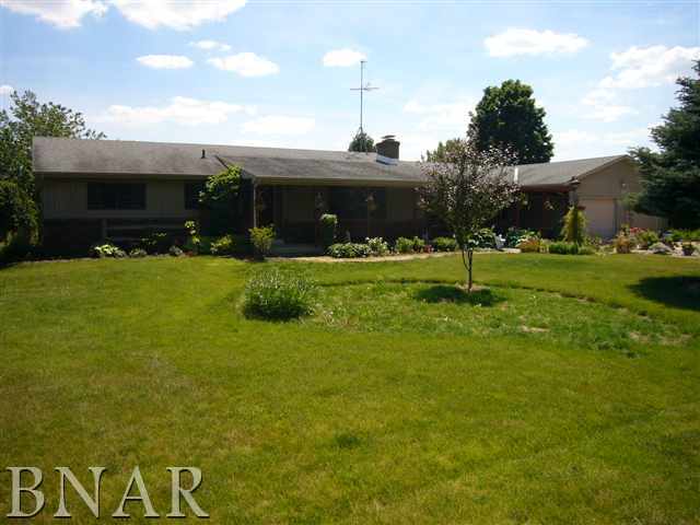 25857 Longview Road Hopedale, IL 61747 - Photo 1 of 1 a front view of house with a garden