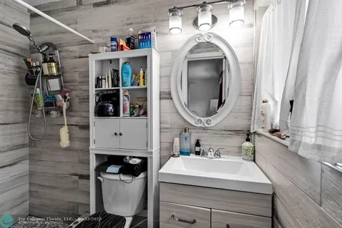 a bathroom with a sink and a mirror