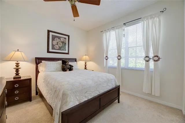 a bedroom with bed and window