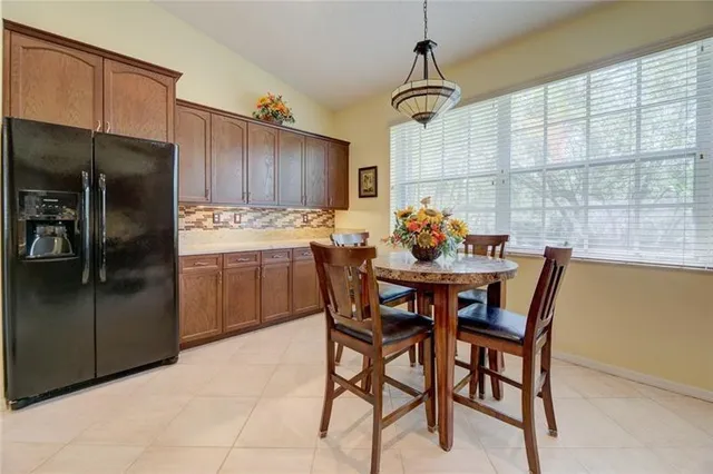 a kitchen with a table and chairs