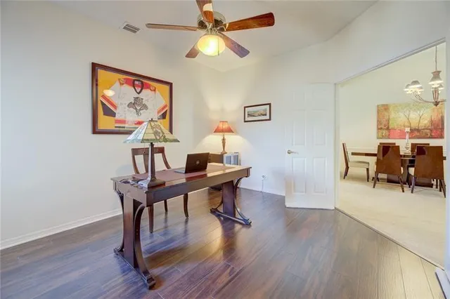 a workspace with furniture and wooden floor