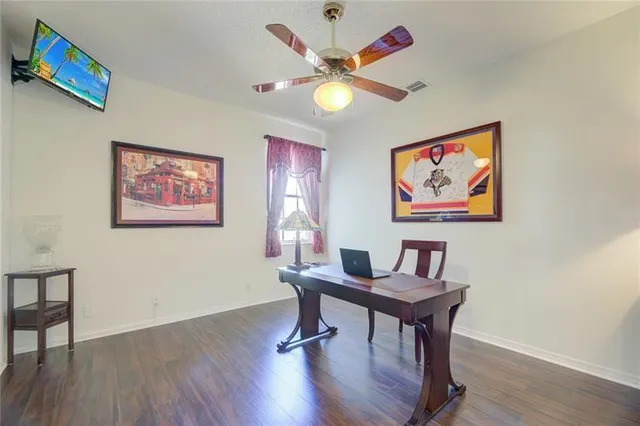 a workspace with furniture and wooden floor