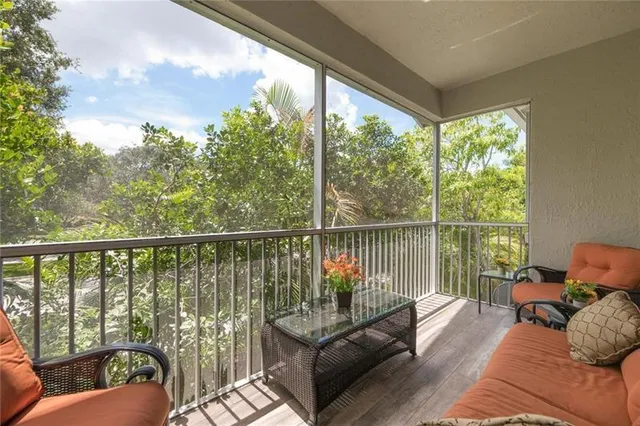 a balcony with wooden floor