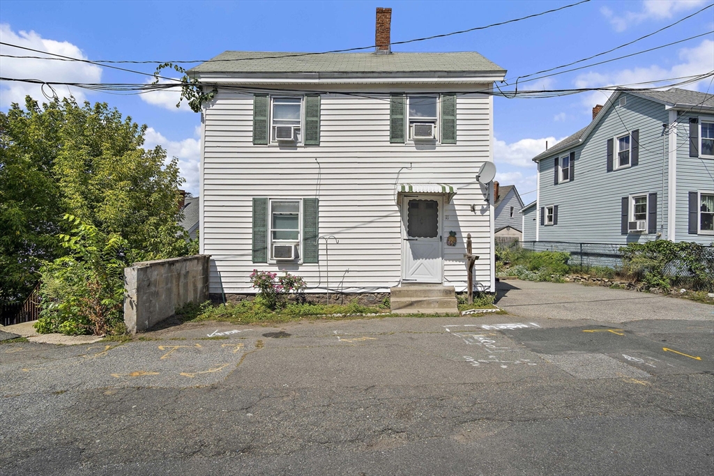a view of a house with a yard and garage