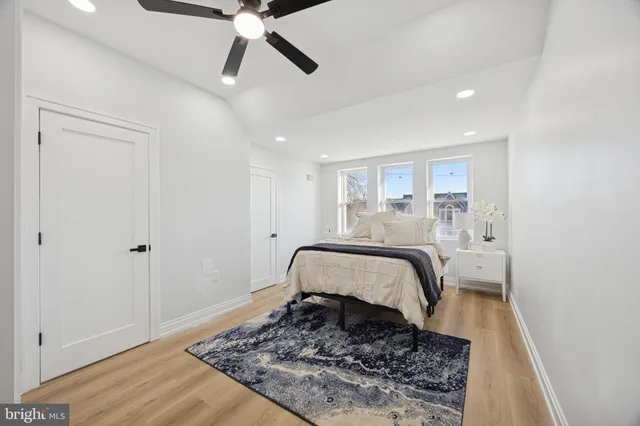 a bed room with a bed and a window