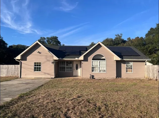 a view of a house with a yard