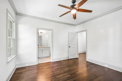 a view of a room with wooden floor