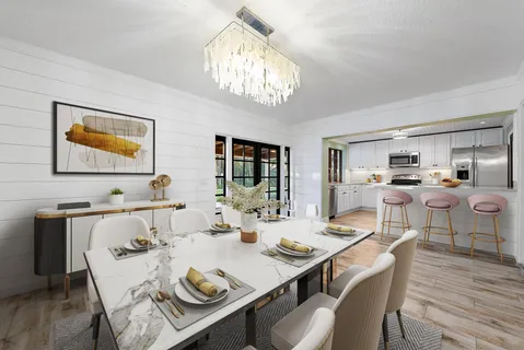 a view of a dining room with furniture a chandelier and wooden floor