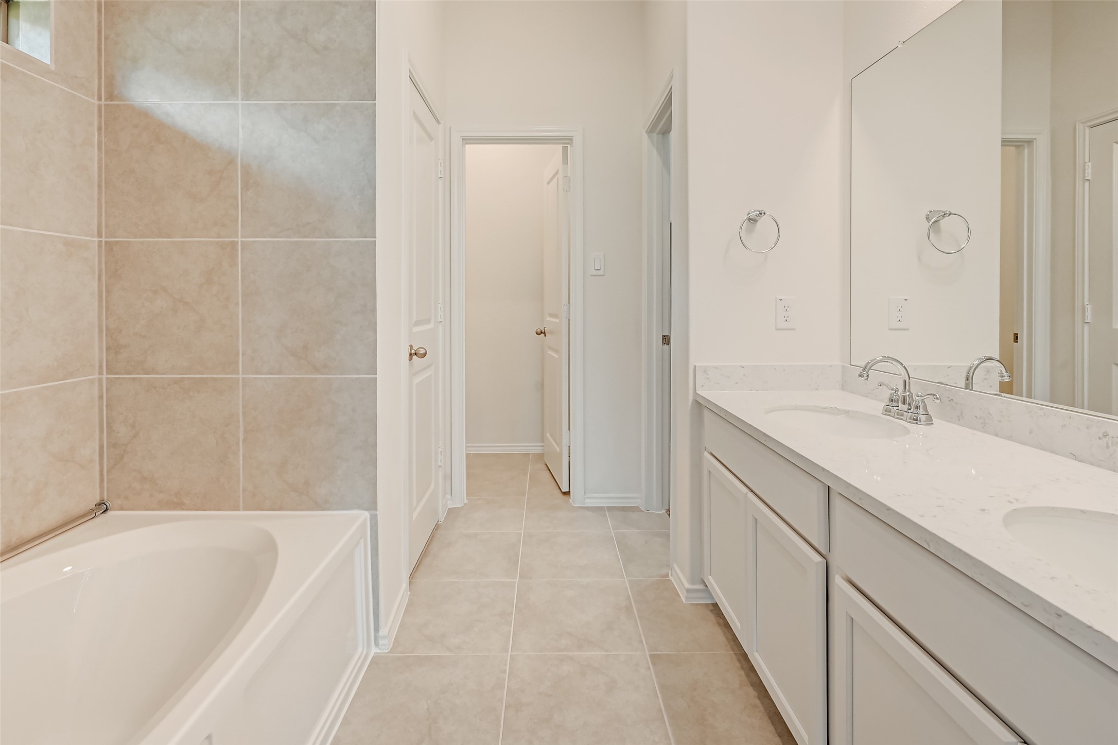 3106 Rising Fir Lane Conroe, TX 77385 - Photo 15 of 32 a bathroom with a bathtub and a sink