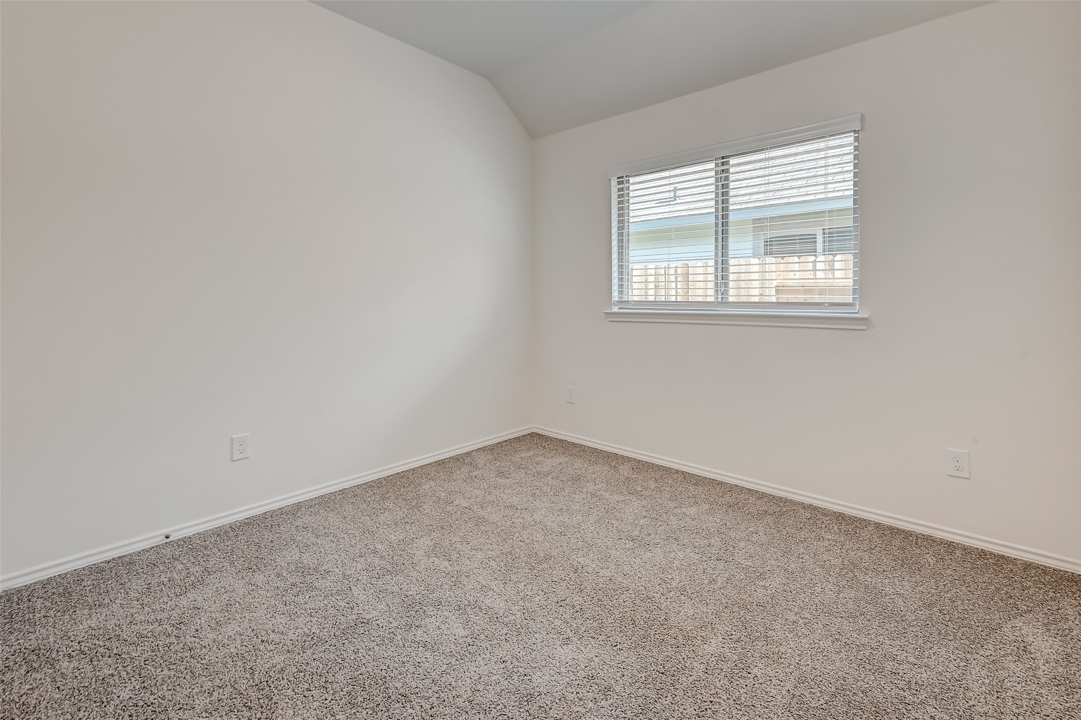 3106 Rising Fir Lane Conroe, TX 77385 - Photo 20 of 32 an empty room with a window
