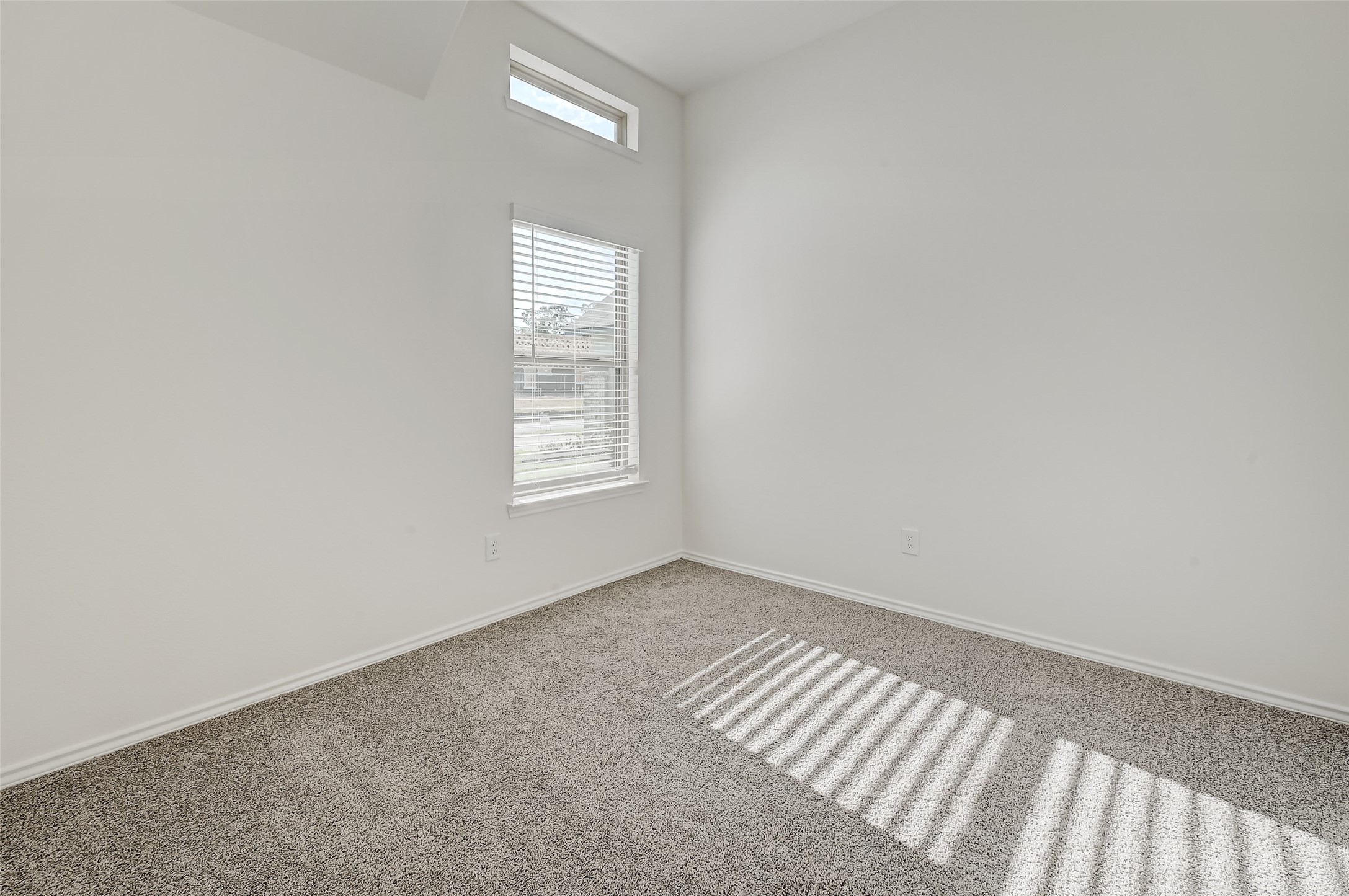 3106 Rising Fir Lane Conroe, TX 77385 - Photo 24 of 32 an empty room with windows