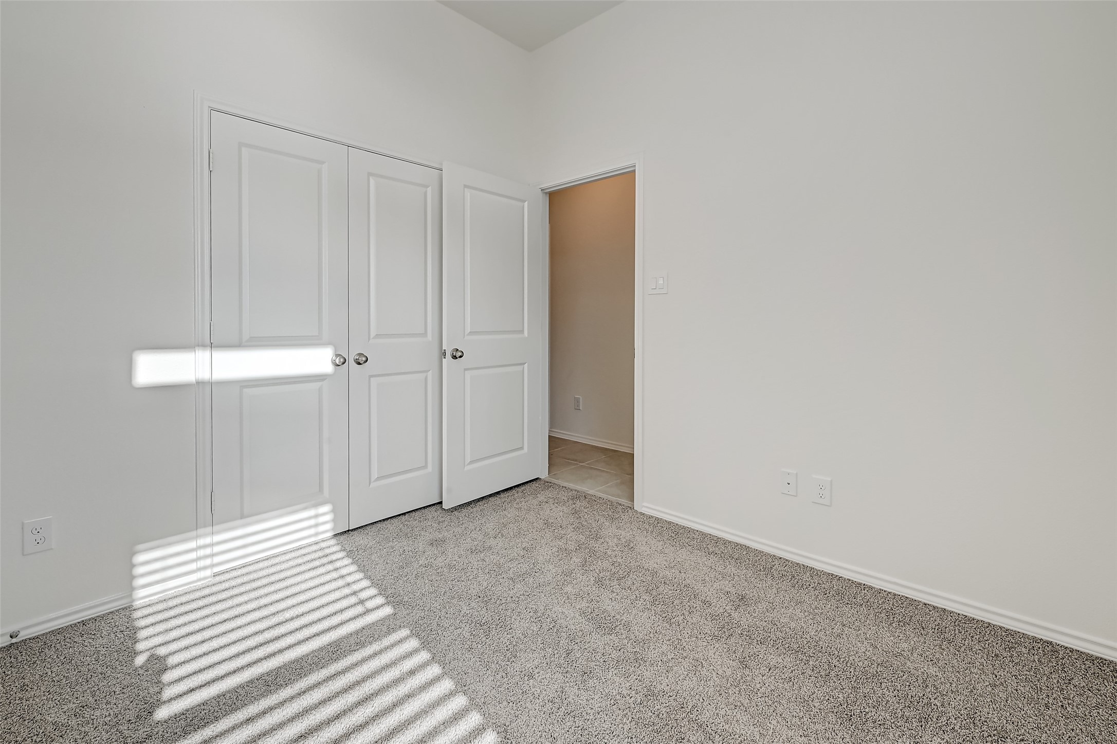 3106 Rising Fir Lane Conroe, TX 77385 - Photo 25 of 32 a view of a bedroom with wooden floor