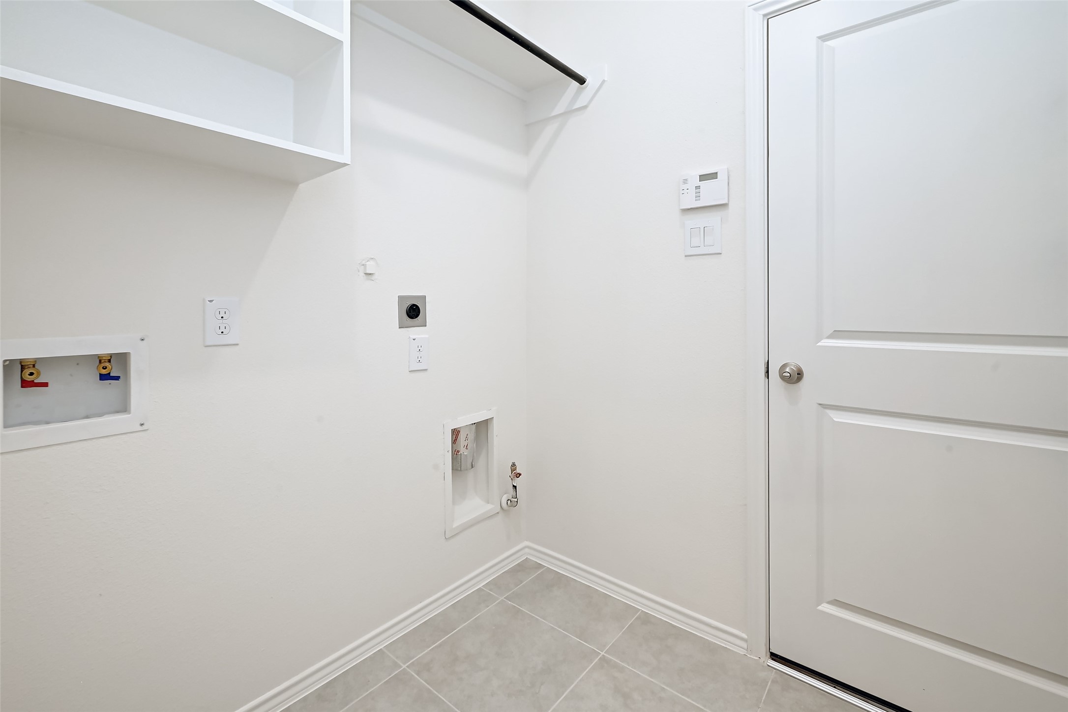 3106 Rising Fir Lane Conroe, TX 77385 - Photo 26 of 32 a view of small space with racks on the wall