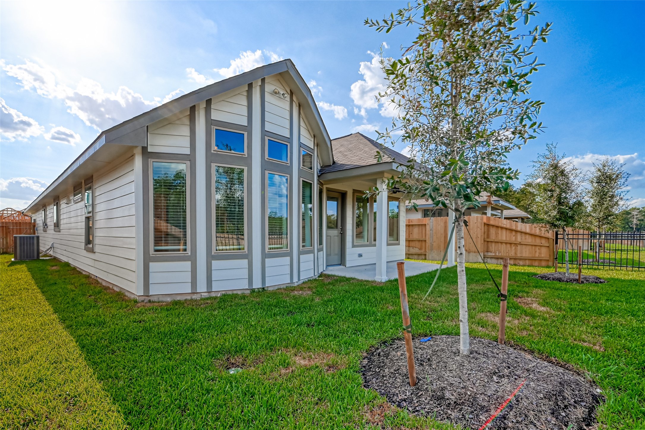 3106 Rising Fir Lane Conroe, TX 77385 - Photo 31 of 32 a view of a house with backyard