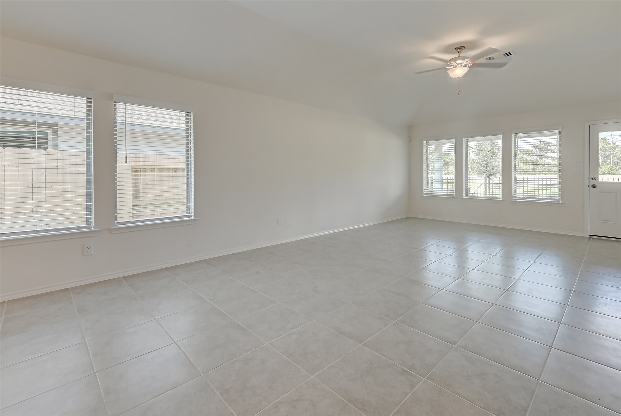 3106 Rising Fir Lane Conroe, TX 77385 - Photo 5 of 32 a view of an empty room with a window