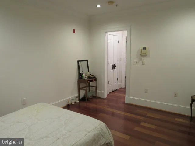 a room that has a bed and a table in it