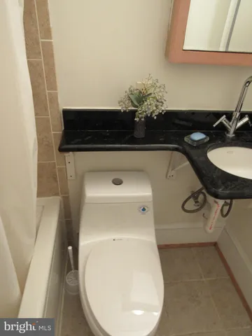 a bathroom with a toilet and a sink