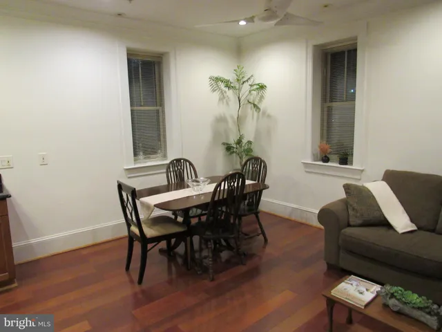 a view of a livingroom with furniture and wooden floor