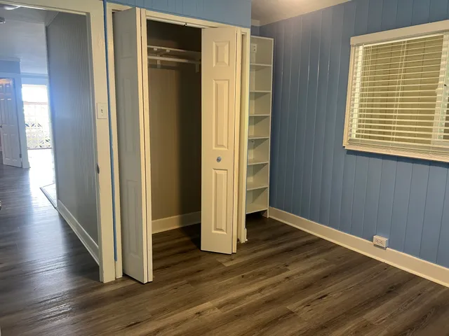 a bathroom with a bathtub a sink a window and a shower