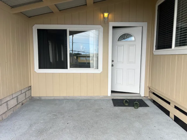 a kitchen with a refrigerator and a sink