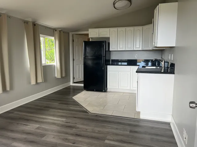 a view of wooden floor and windows in a room