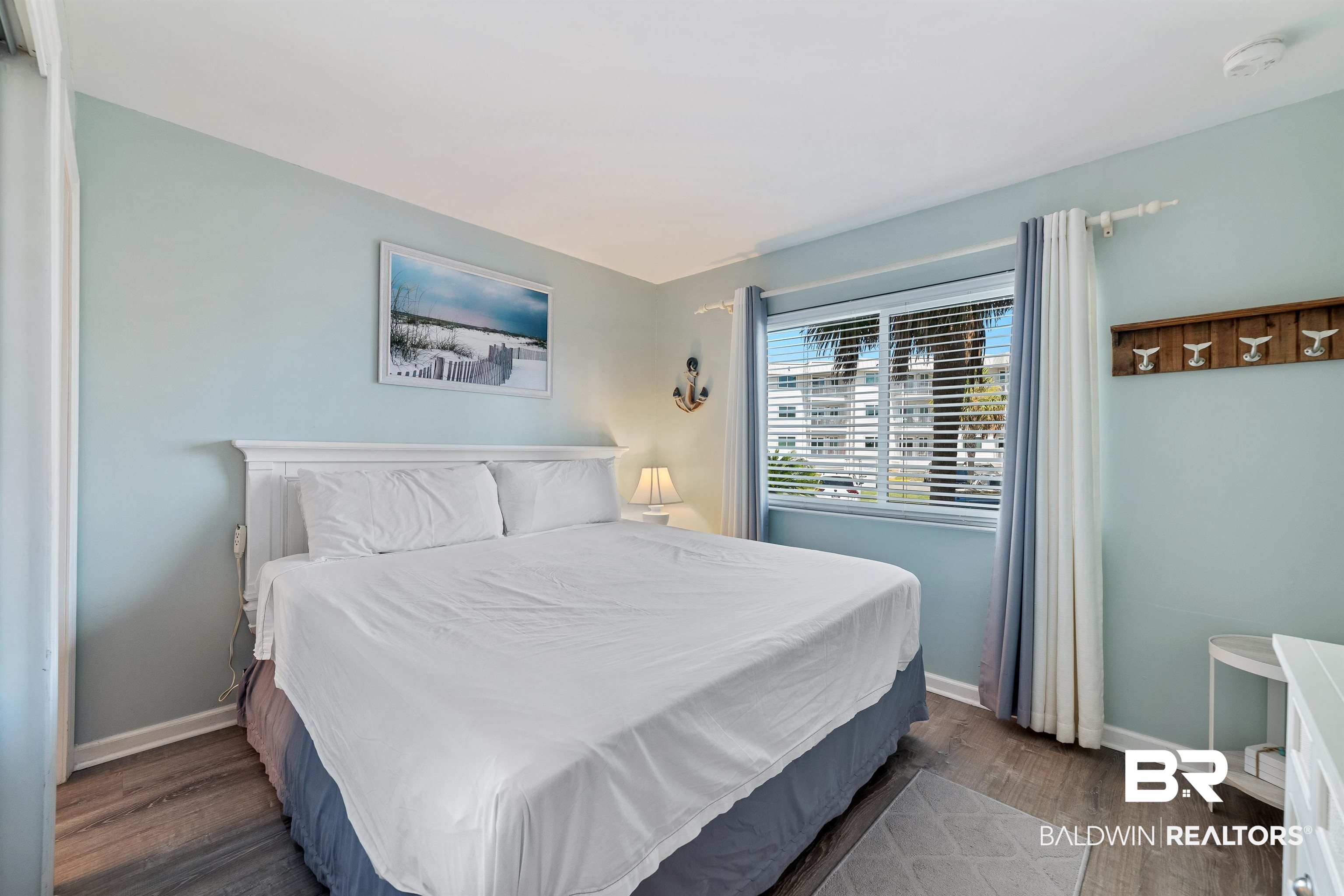 400 Plantation Road, Unit 2123 Gulf Shores, AL 36542 - Photo 15 of 44 Bedroom featuring dark wood-type flooring