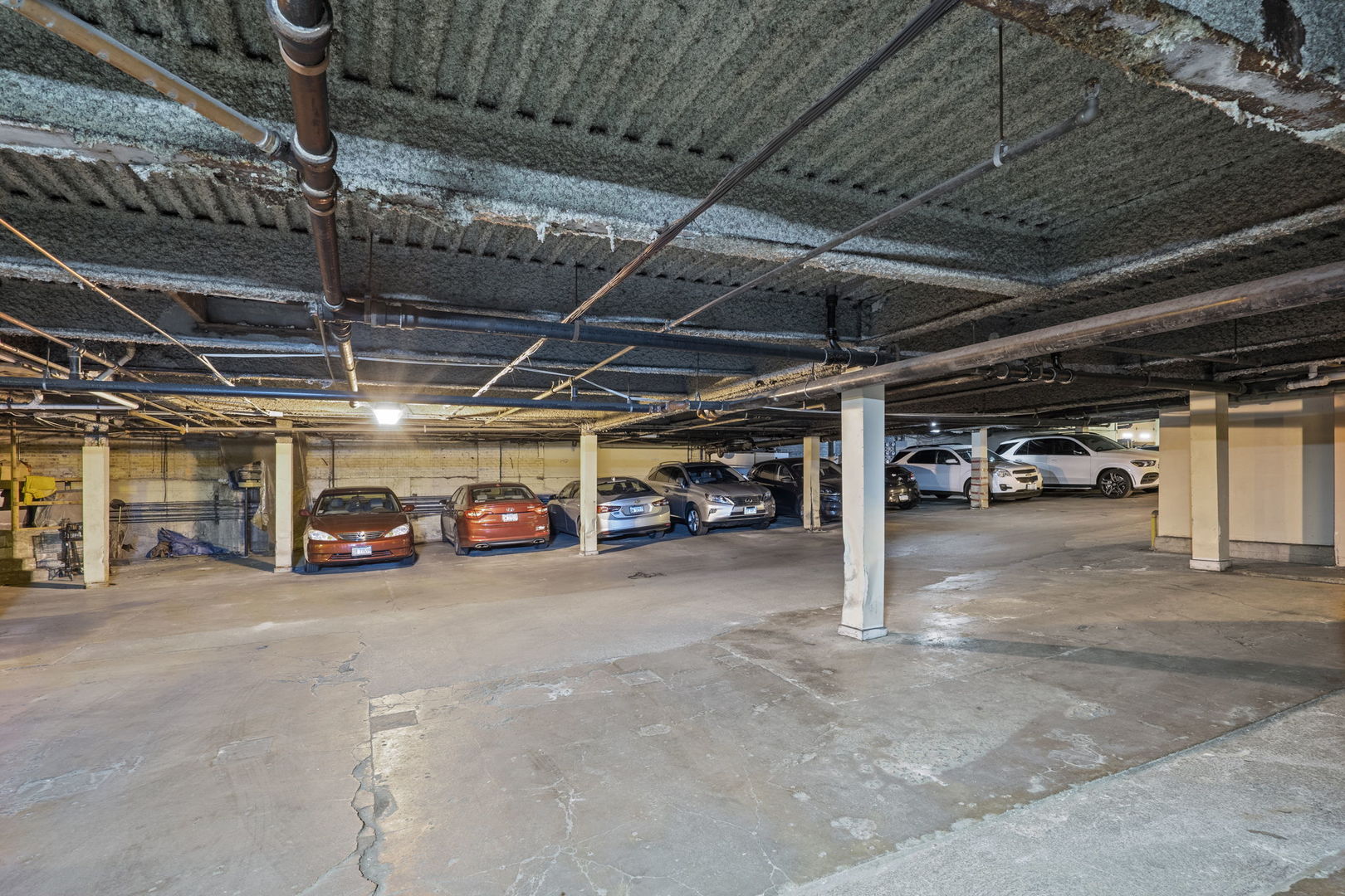 6337 Roosevelt Road, Unit 208 Berwyn, IL 60402 - Photo 14 of 14 a view of parking garage with cars