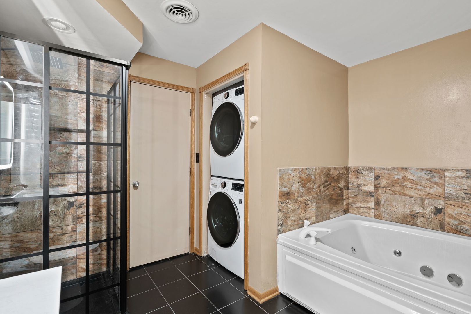 6337 Roosevelt Road, Unit 208 Berwyn, IL 60402 - Photo 7 of 14 a bathroom with a bathtub and a shower
