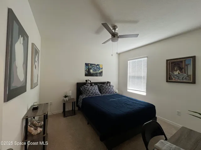 a kitchen with a refrigerator and a stove