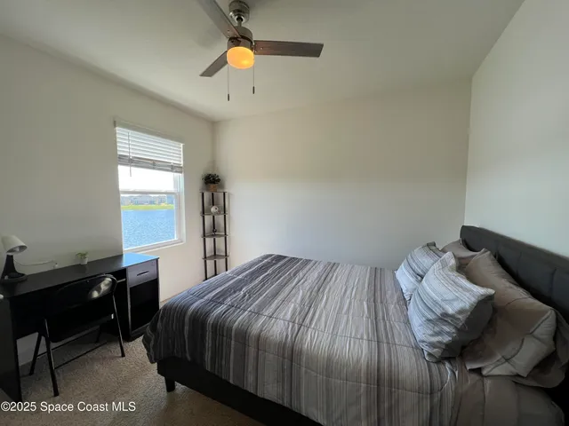 a bathroom with a granite countertop sink a toilet and bathtub