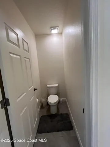 a bathroom with a granite countertop sink mirror and shower