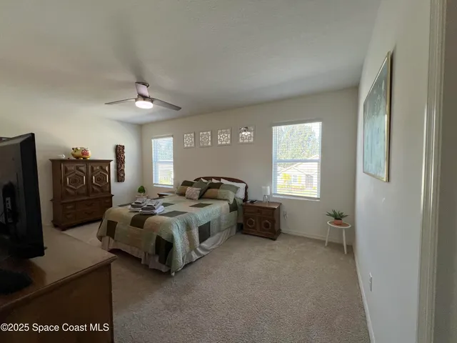 a bed room with a bed and a window