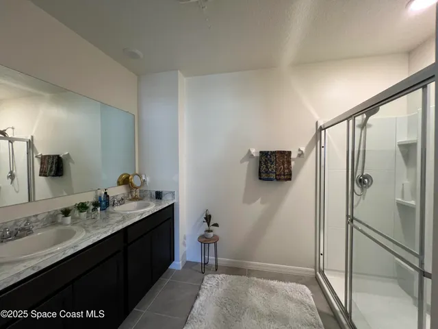 a bed room with bed and a window