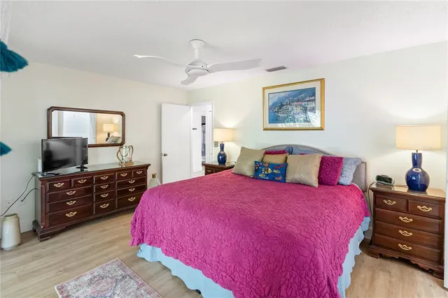 a view of a patio with a table and chairs under an umbrella
