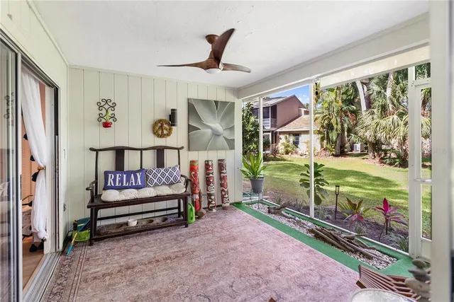 a view of backyard of house with green space