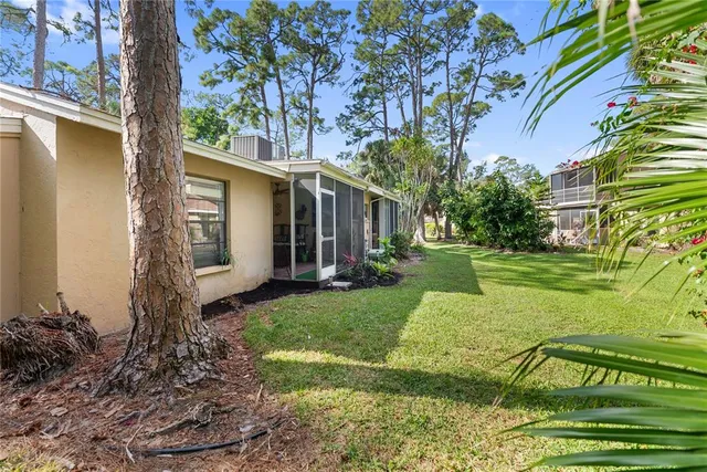 a view of a house with swimming pool and a yard