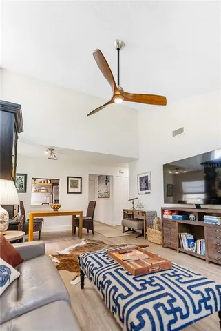 a living room with furniture or couch and a dining table