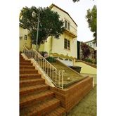 a view of a balcony with chairs